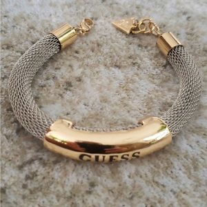 GUESS BRACELET IN SILVER AND GOLD COTTON ENGRAVED ON IT
